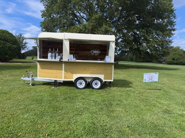 The Compass Mobile Bar trailer set up on the course at the 200 Club of Ocean County Golf Outing