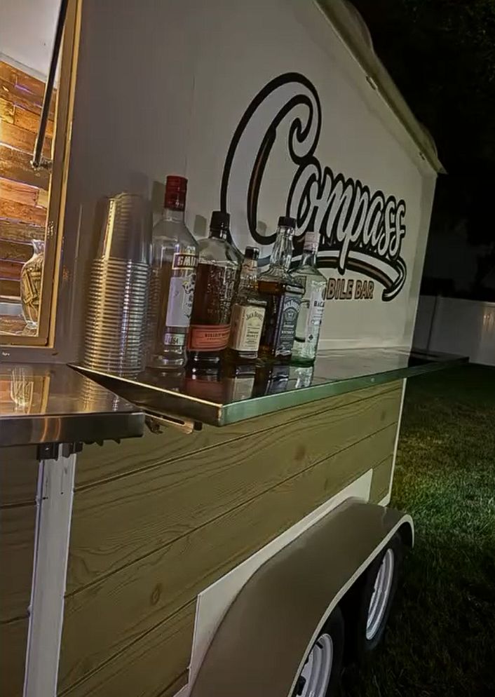 Bottles of spirits lined up on the Compass trailer bar top