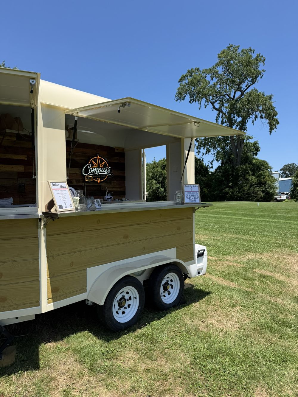 The Compass Mobile Bar serving window with drink menu and Thank You Golfers sign at a New Jersey golf outing