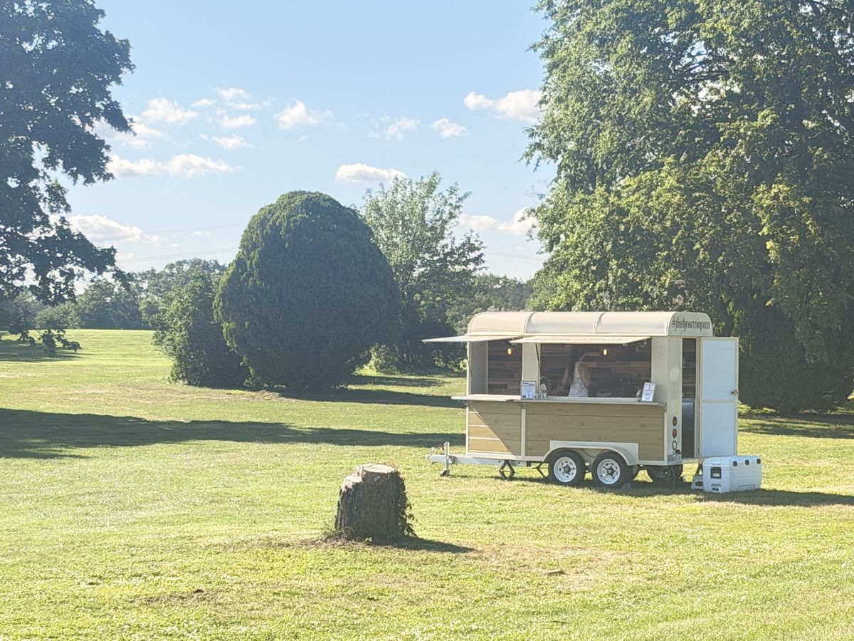 The Compass trailer parked fairway-side at a New Jersey golf outing