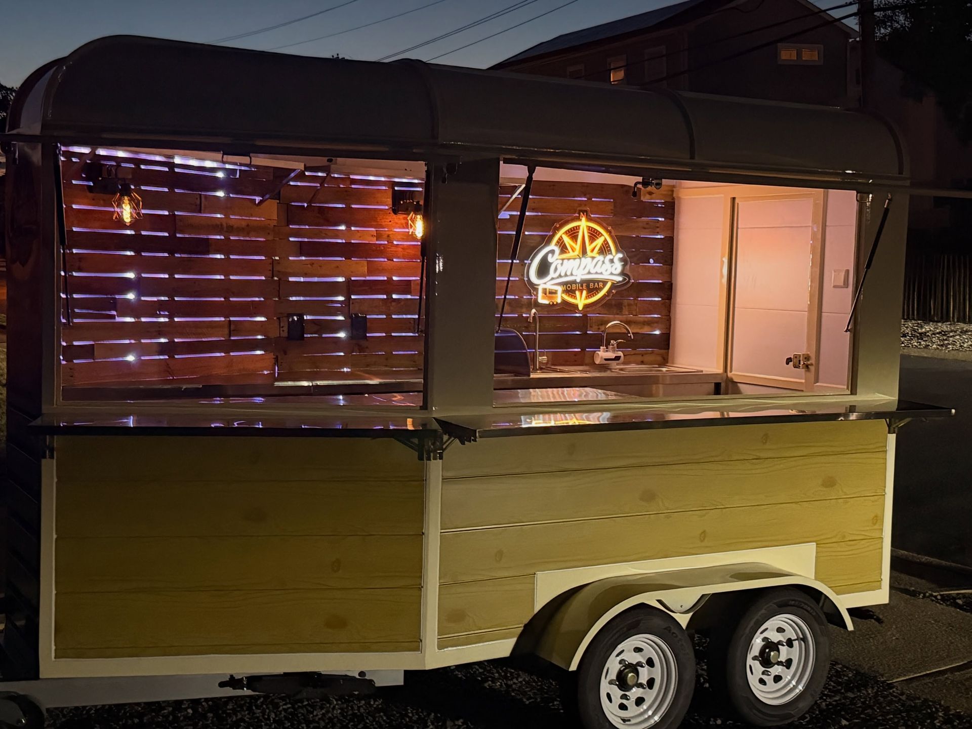 The Compass trailer glowing at dusk