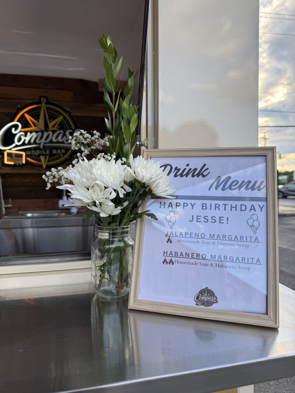 Framed Compass drink menu reading Happy Birthday Jesse with jalapeno and habanero margaritas at Somay Memorial Hall in Howell NJ