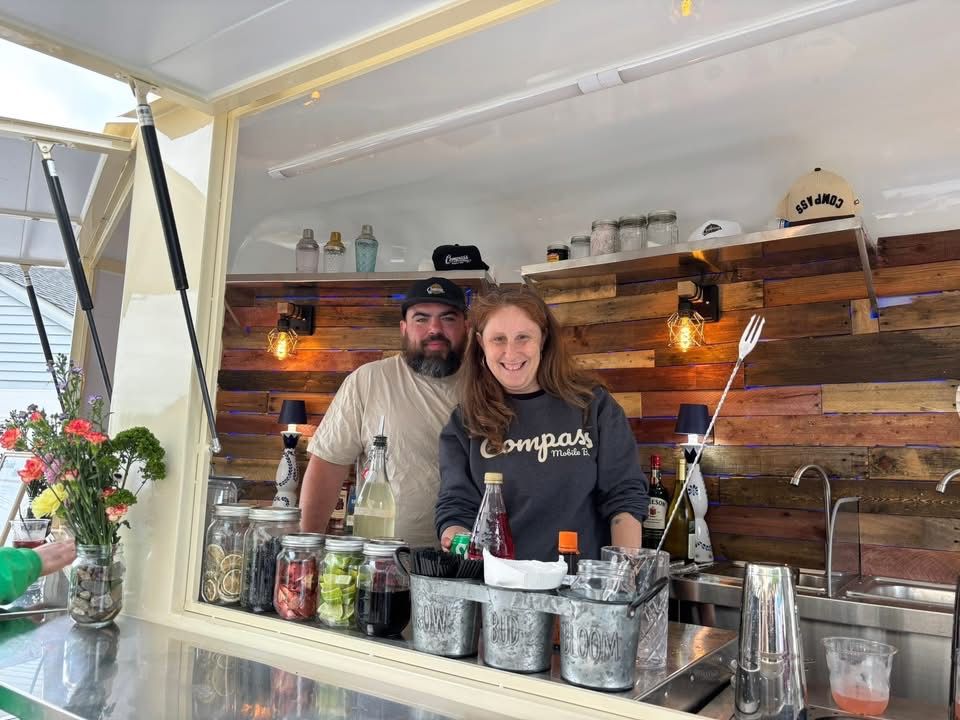 The Compass trailer bar fully set up and pouring at the launch party