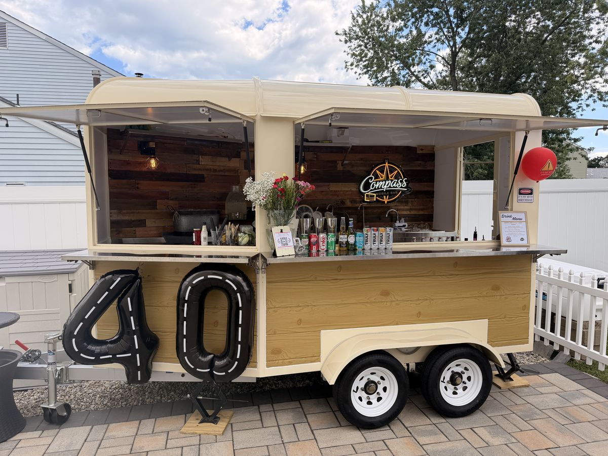 The Compass trailer decorated with giant 40 balloons at a Manasquan birthday party