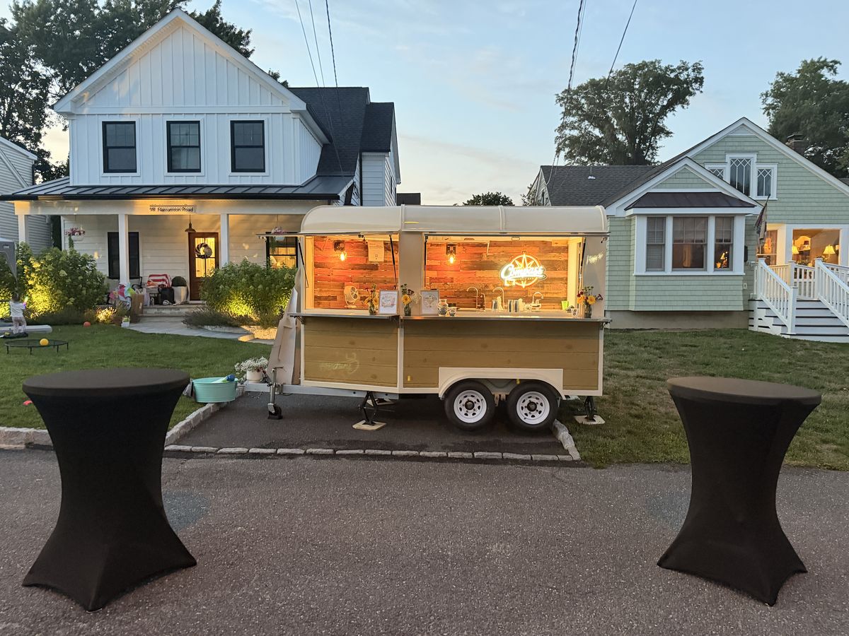 The Compass trailer glowing at dusk at a Manasquan block party