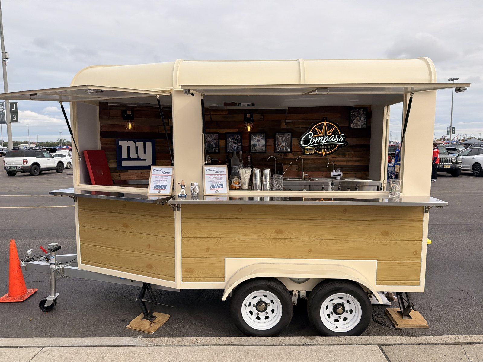 The Compass Mobile Bar trailer parked in the MetLife Stadium lot with the serving window open