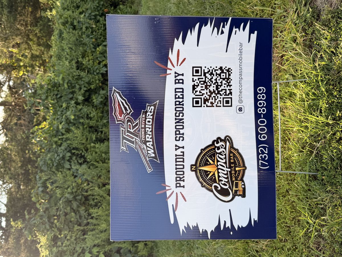 Toms River Warriors sponsorship sign showing Compass Mobile Bar as a proud sponsor